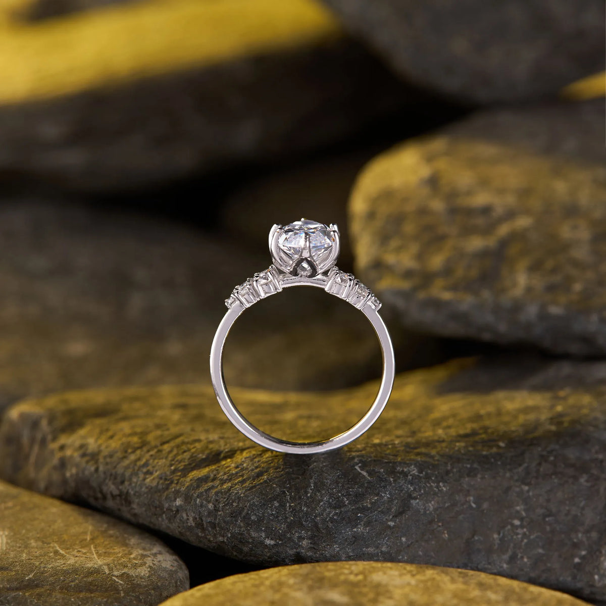 timeless marquise moissanite diamond ring with delicate sparkling side stone detailing and elegant engagement ring