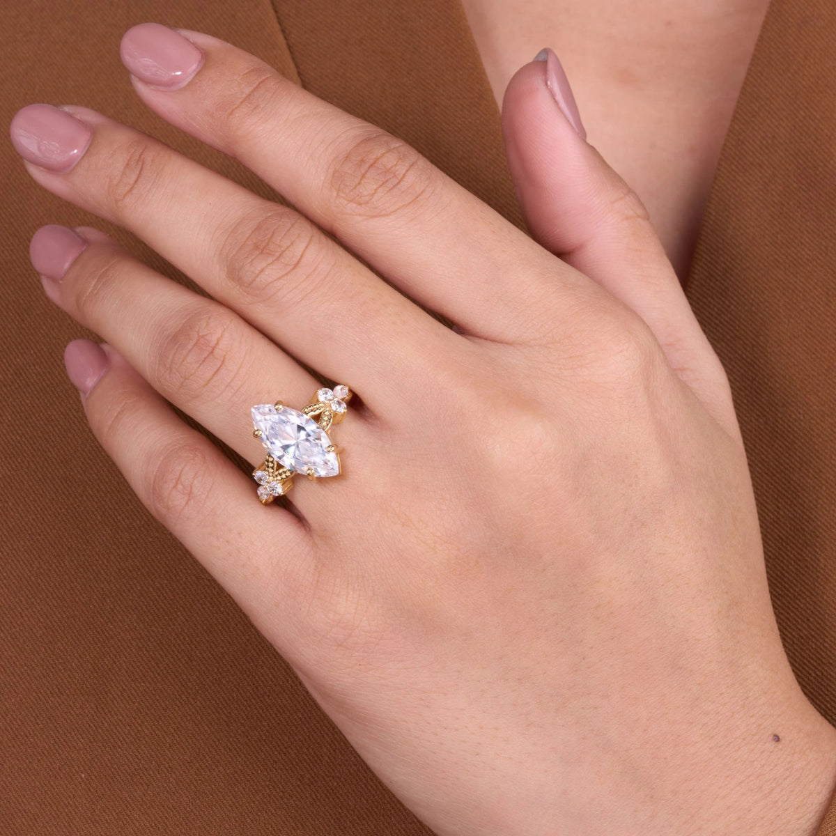vintage moissanite marquise cut diamond ring with elegant floral inspired detailing and timeless sparkling statement design