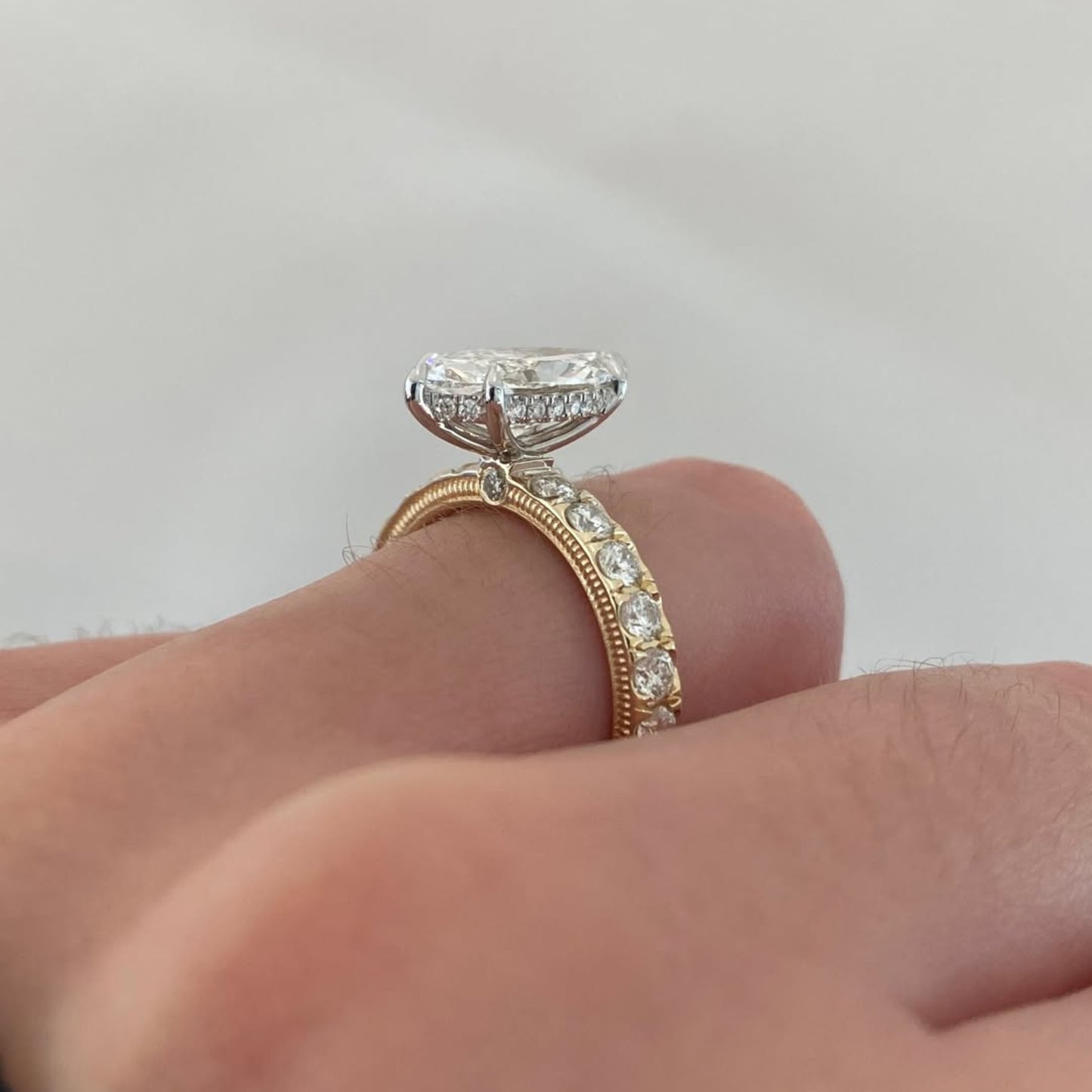 marquise moissanite diamond engagement ring yellow gold band with side diamonds vintage milgrain setting