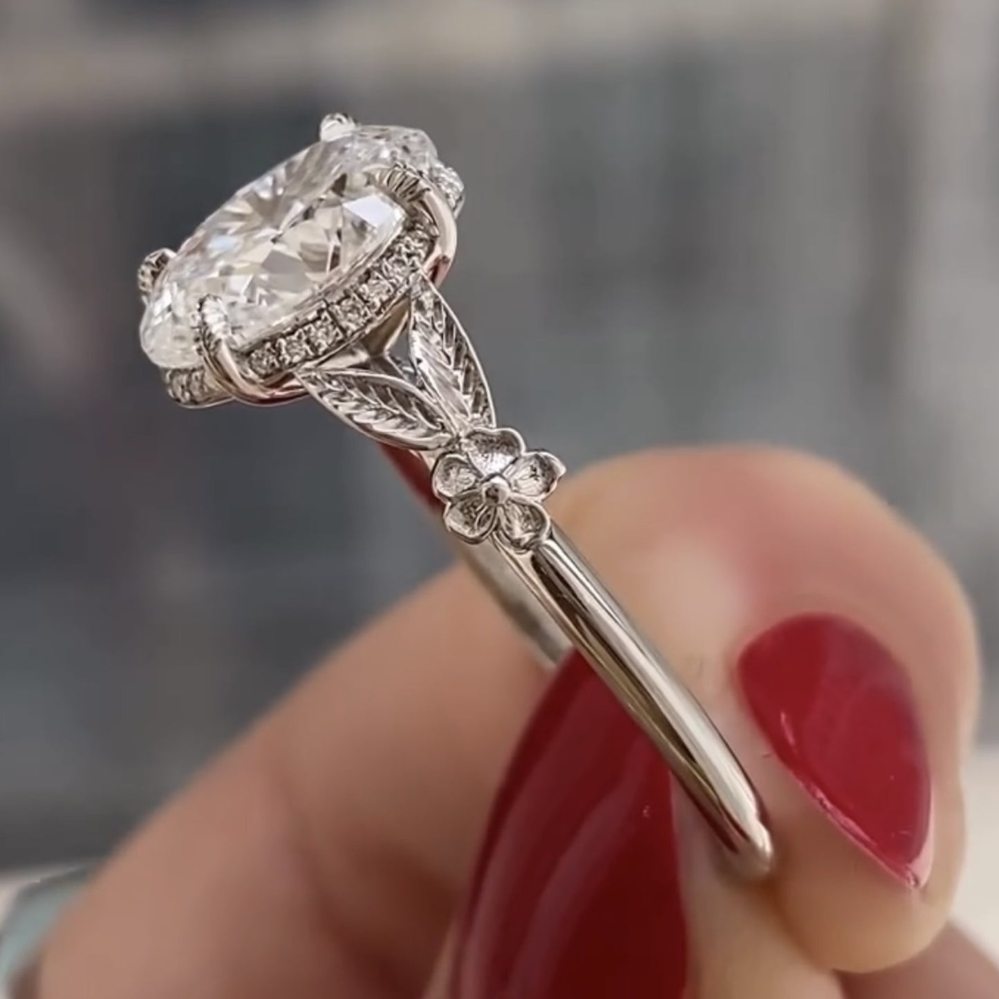 oval moissanite diamond engagement ring with floral leaf art deco setting in white gold