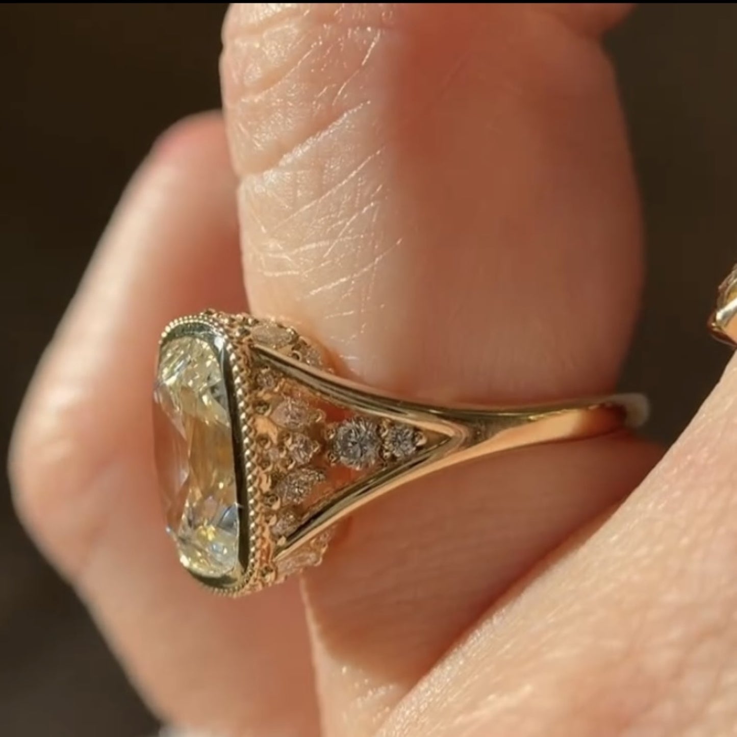 old mine elongated cushion moissanite engagement ring bezel set vintage inspired ring