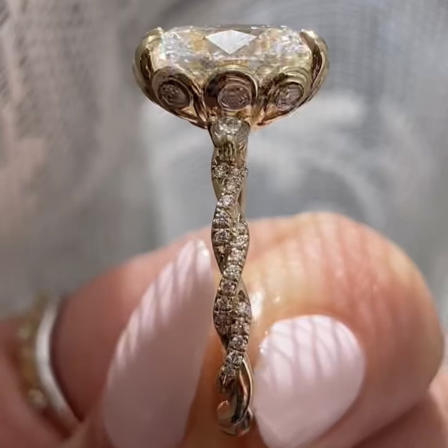 oval cut moissanite diamond engagement ring with twisted pave band