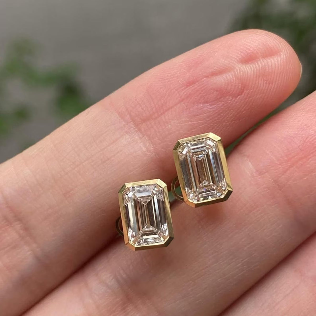 2.00 tcw emerald cut moissanite diamond stud earring eight with bezel set