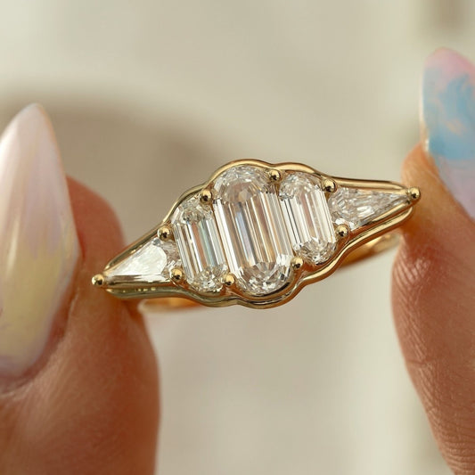1.30 TCW Elegant Emerald Cut Multi-Stone Moissanite Diamond Ring with Trillion Side Accents in Gold Ring