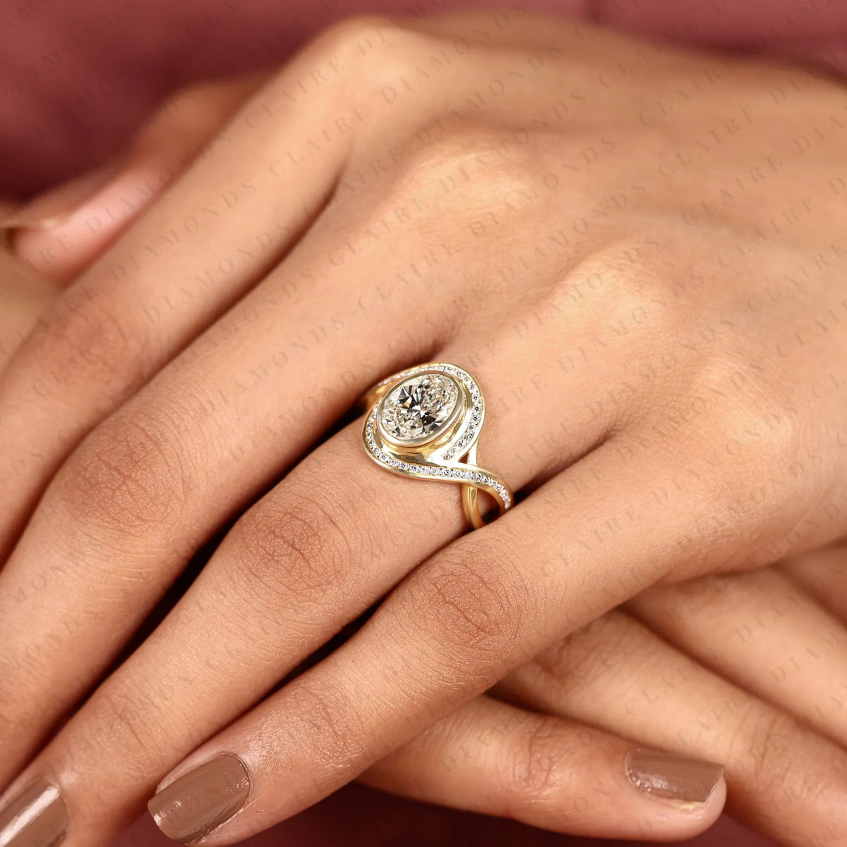 oval cut lab grown diamond engagement ring | pavé bezel halo yellow gold bypass ring | twisted split shank bridal jewelry | modern statement ring