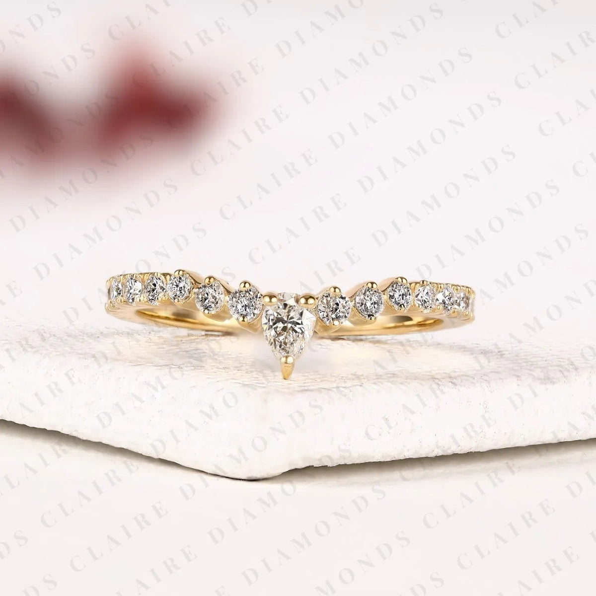 0.64 tcw classic pear cut lab grown diamond anniversary ring with delicate round brilliant diamonds and everyday sparkle