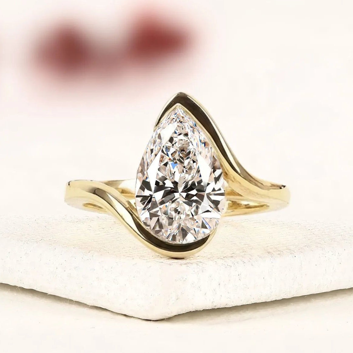 pear shape lab grown diamond hidden halo solitaire ring with contemporary twist setting