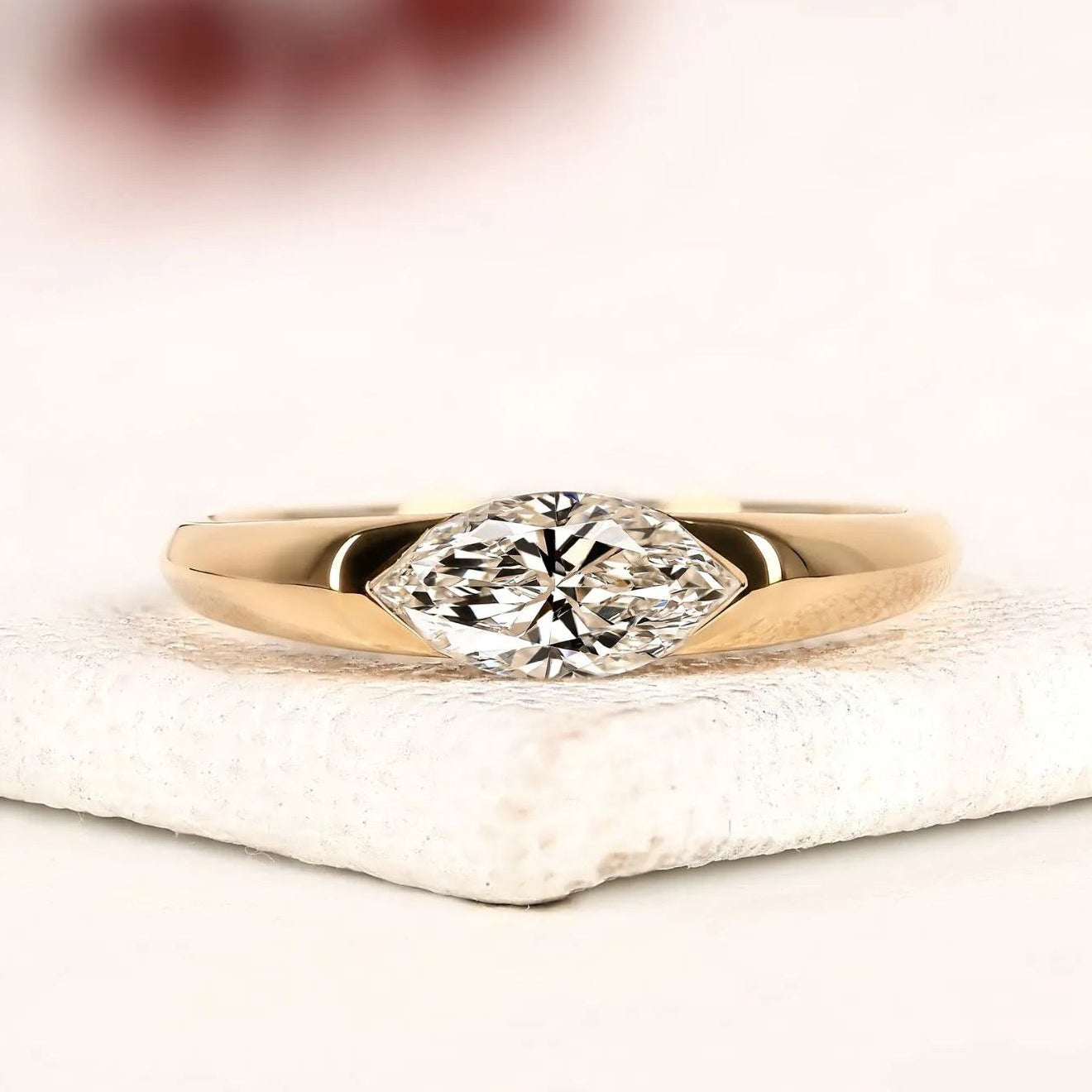 minimalist marquise cut solitaire lab grown diamond engagement ring in yellow gold | modern bezel-inspired promise ring for women.
