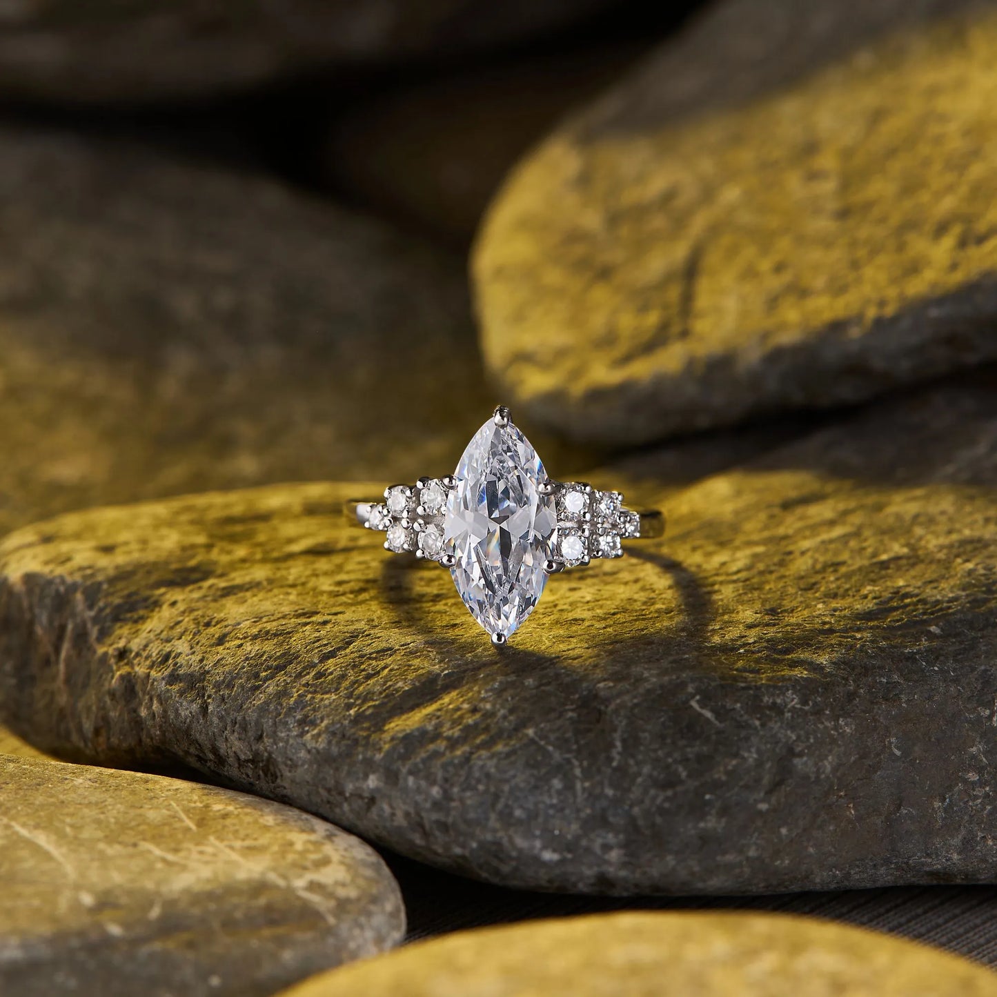 timeless marquise lab grown diamond ring with delicate sparkling side stone detailing and elegant engagement ring