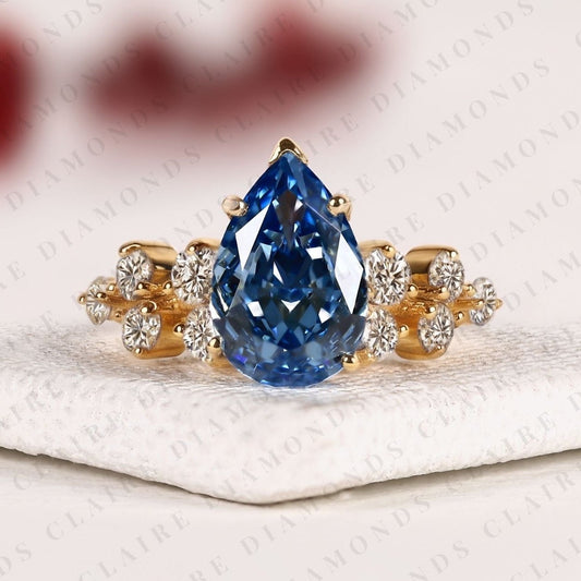 Pear Cut Blue Lab Grown Engagement Ring, Round Diamond Floral Side Stones, Yellow Gold Nature-Inspired Bridal Ring