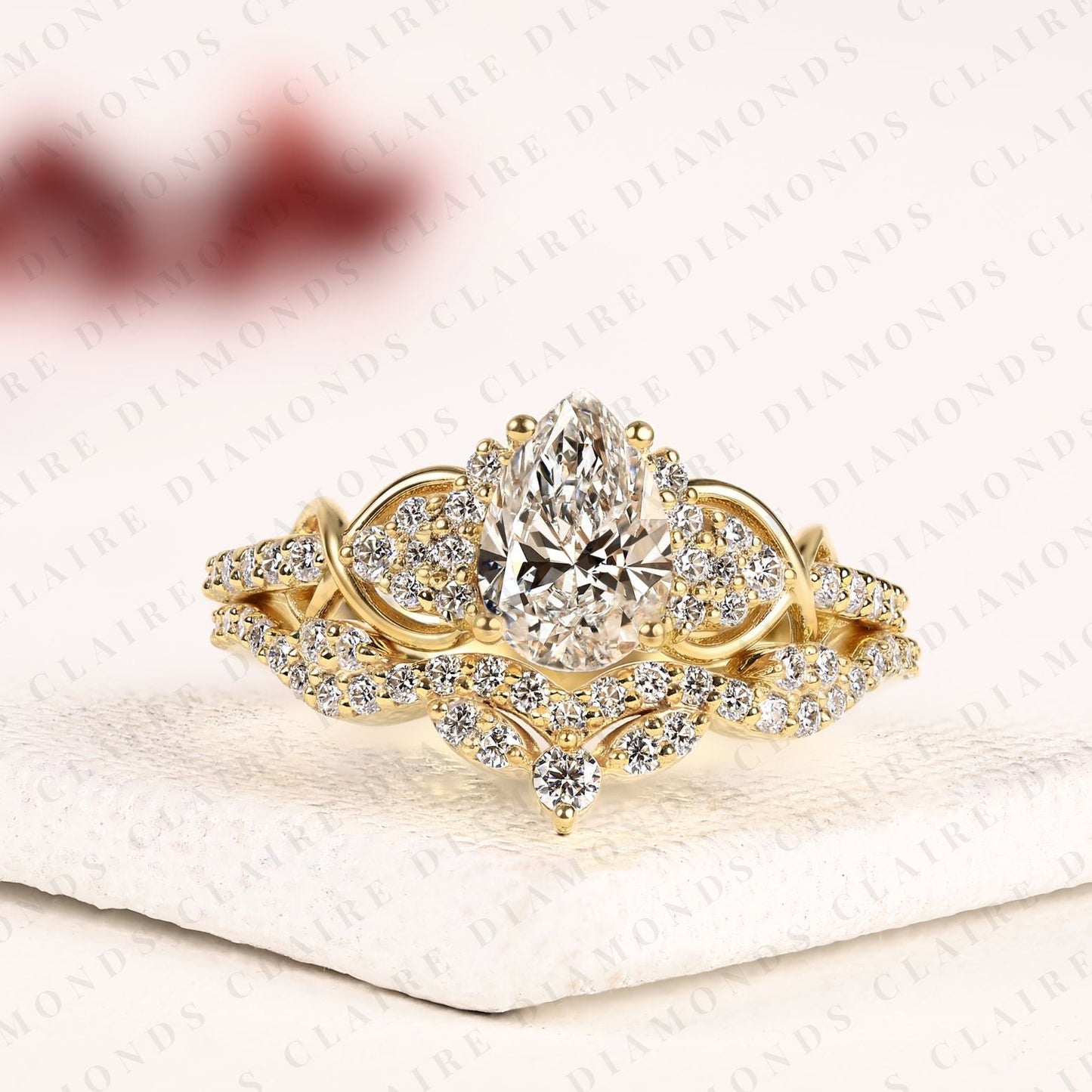 pear cut moissanite diamond bridal ring set | nature-inspired twisted leaf yellow gold engagement ring