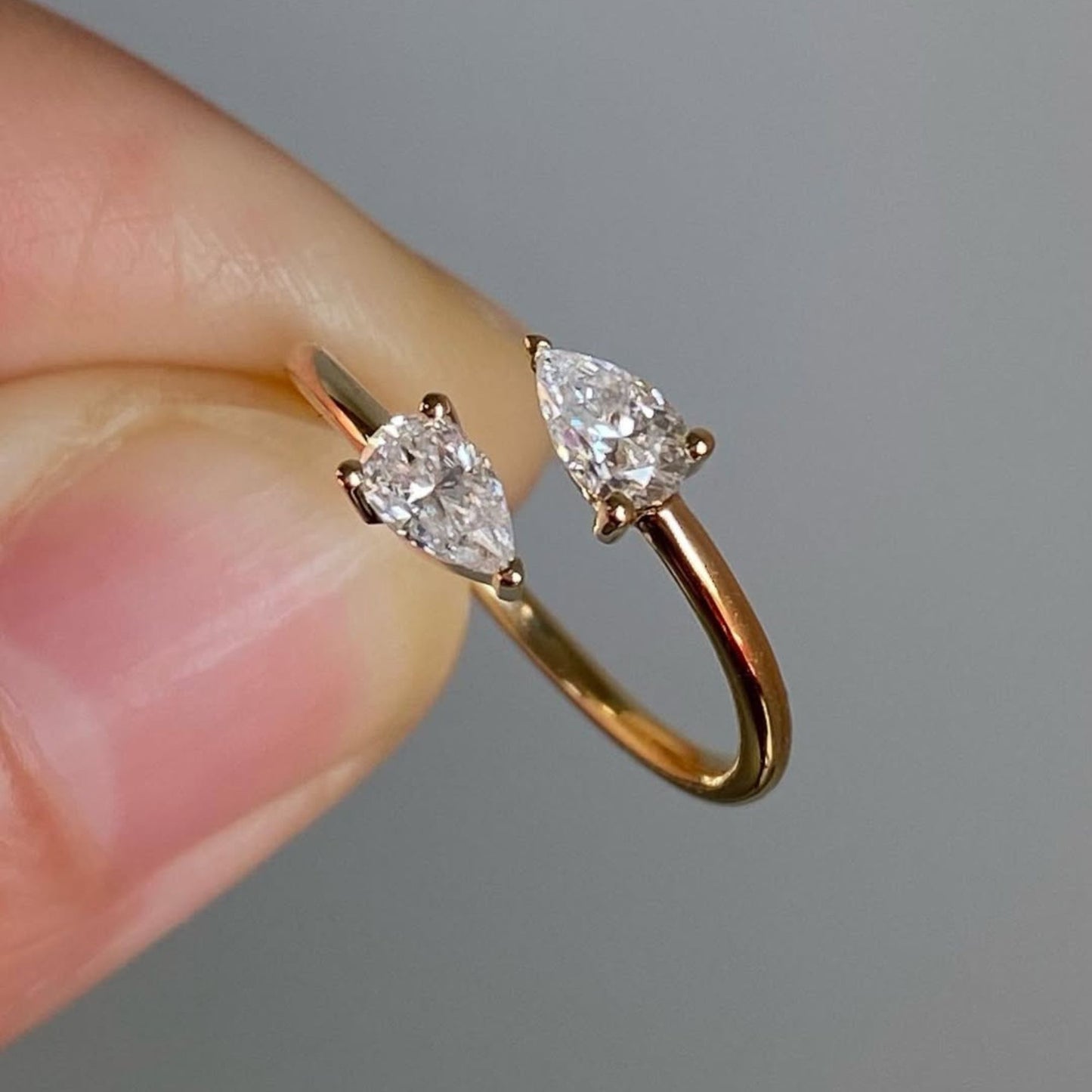 1.00 tcw elegant open bypass moissanite diamond pear cut diamond ring in minimalist double stone ring