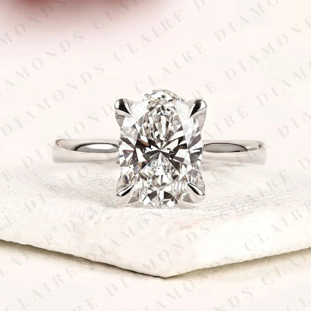 oval cut lab grown diamond solitaire engagement ring, four prong hidden tulip setting, minimalist white gold proposal ring