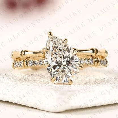Luxury Pear Cut Moissanite Diamond Engagement Ring with Pavé Diamond Accents and Bamboo Inspired Matching Wedding Band Set