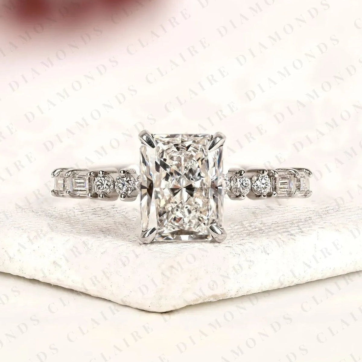 radiant cut moissanite diamond engagement ring with round and baguette side stone accents