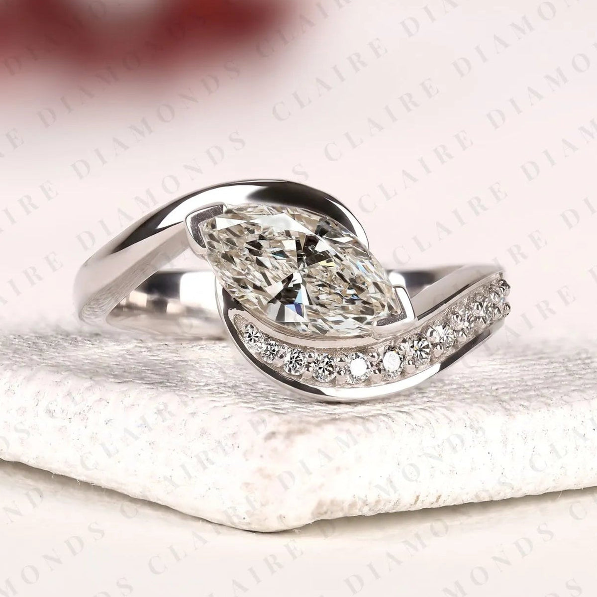 marquise cut lab grown diamond east west bypass engagement ring in gold with round side stones , modern bridal jewelry.