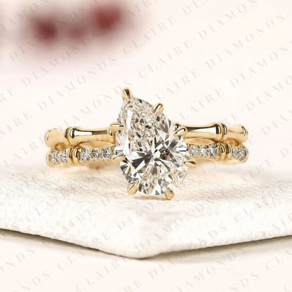 Luxury Pear Cut Lab Grown Diamond Engagement Ring with Pavé Diamond Accents and Bamboo Inspired Matching Wedding Band Set