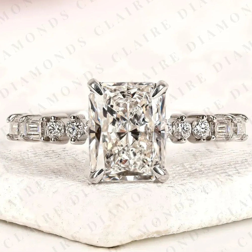 radiant cut moissanite diamond engagement ring with round and baguette side stone accents