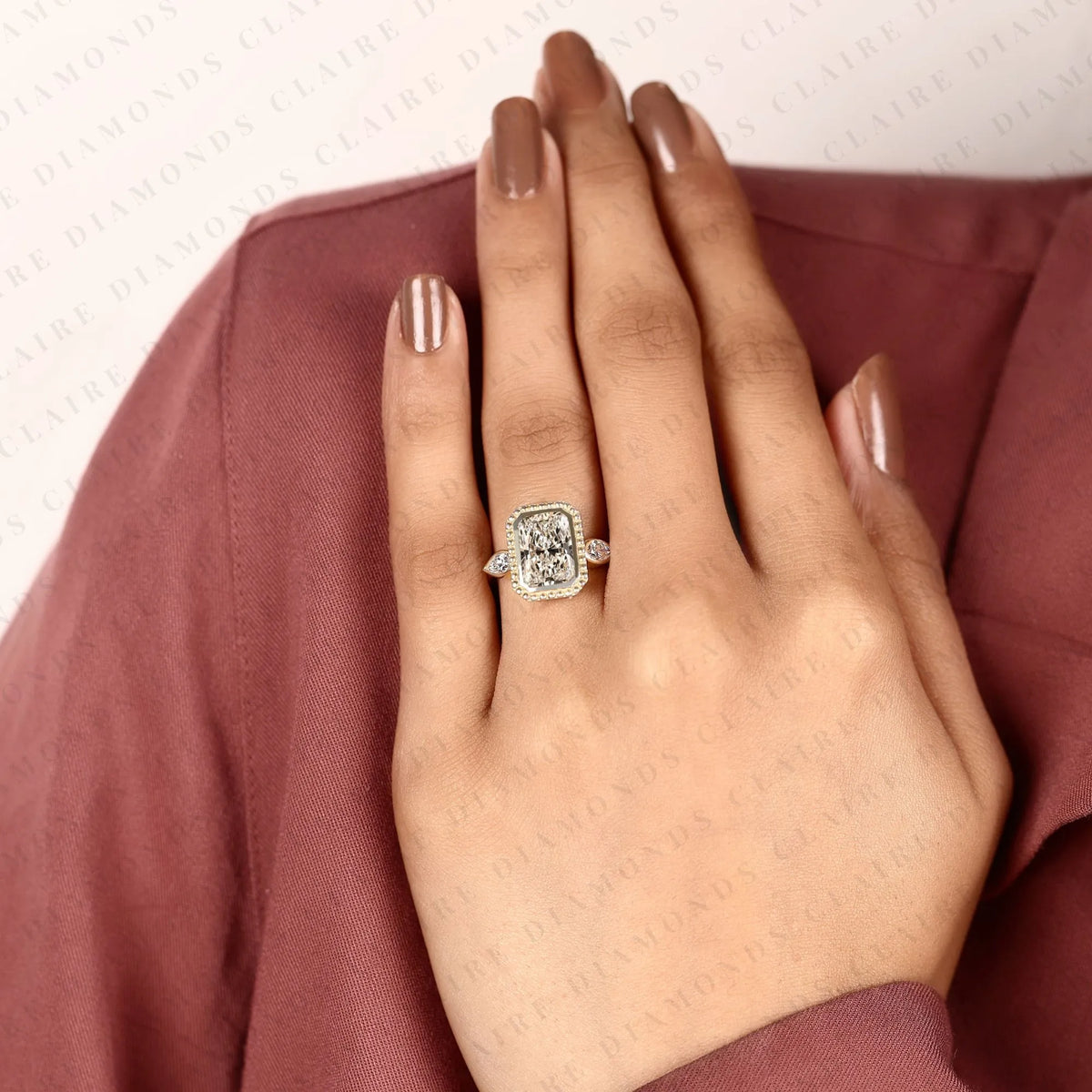 radiant cut lab grown diamond three stone engagement ring | pear cut side stone gold ring | beaded bezel statement bridal jewelry | modern luxury wedding ring