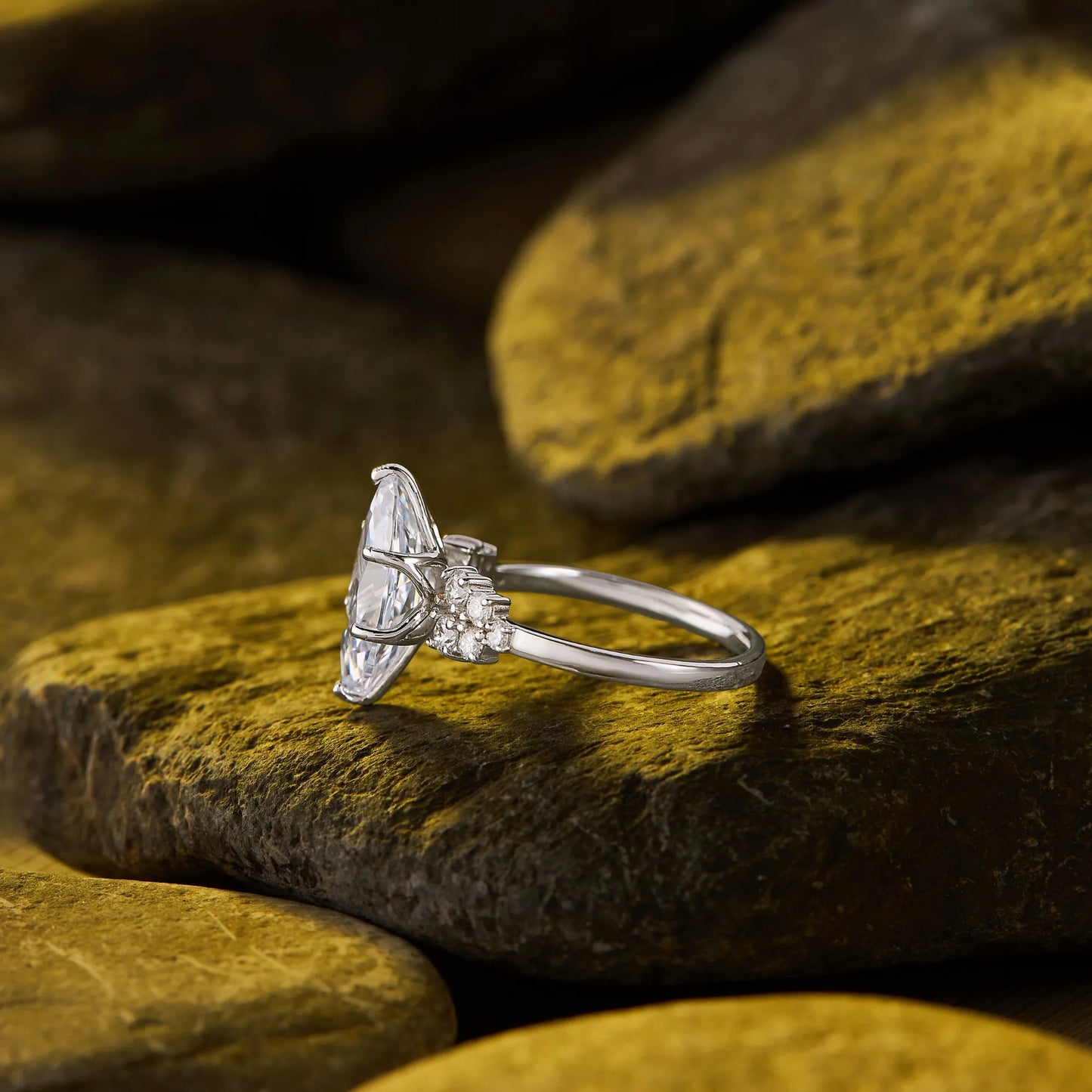 timeless marquise lab grown diamond ring with delicate sparkling side stone detailing and elegant engagement ring