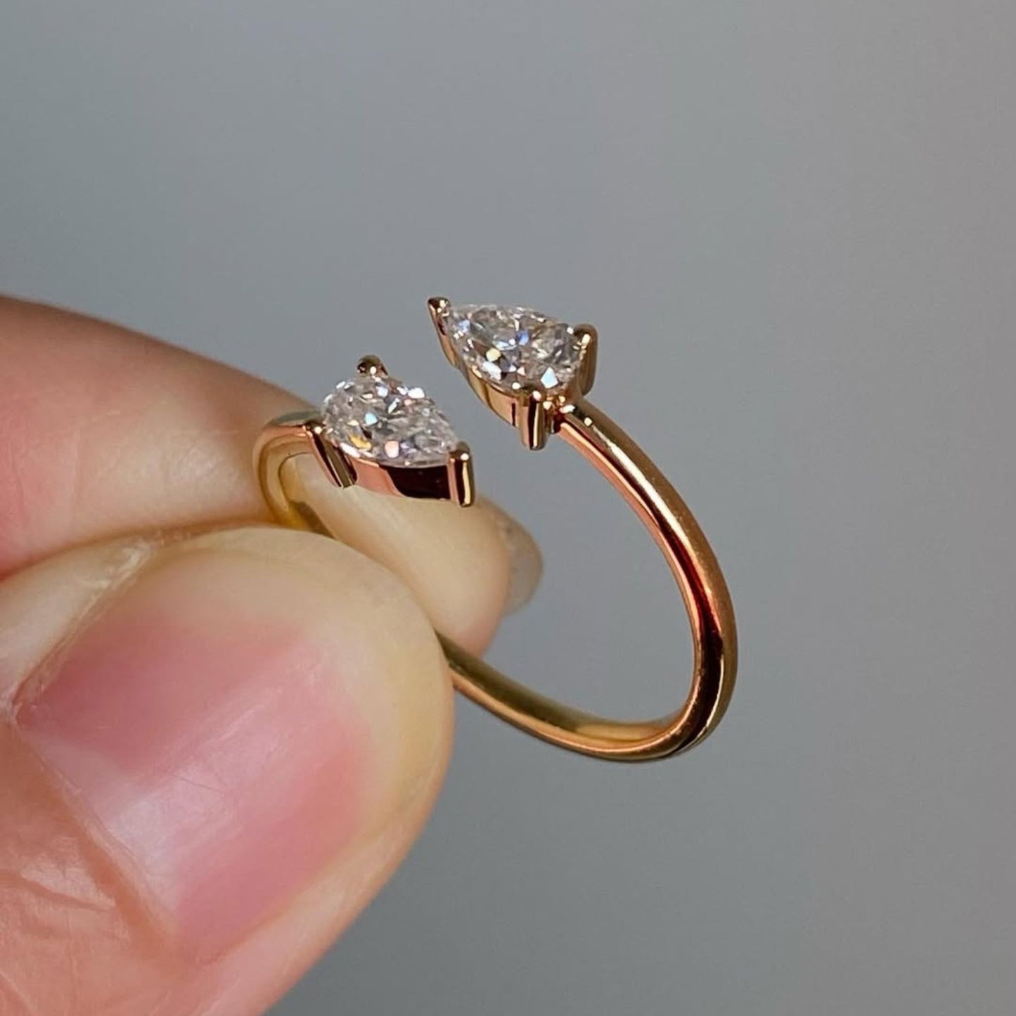 1.00 tcw elegant open bypass moissanite diamond pear cut diamond ring in minimalist double stone ring