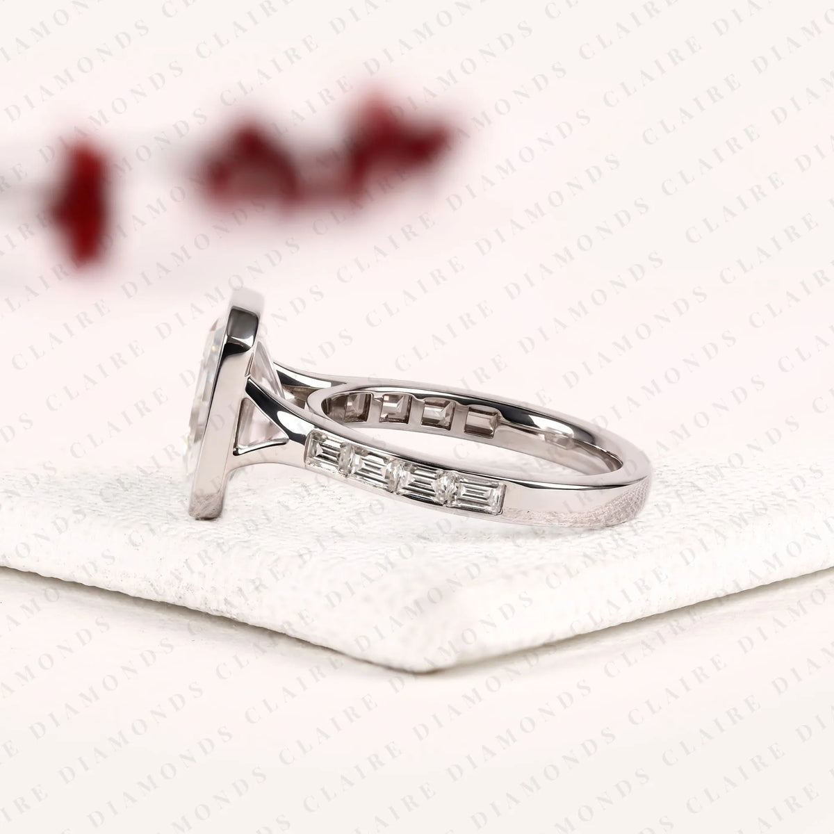 radiant cut moissanite diamond bezel set engagement ring with baguette pave set white gold modern luxury bridal jewelry