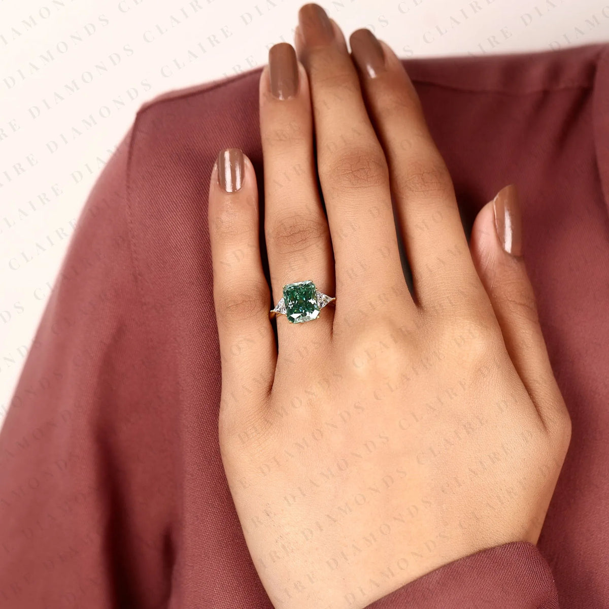 radiant cut green lab grown diamond engagement ring  three stone ring with trillion diamond accents luxury bridal jewelry