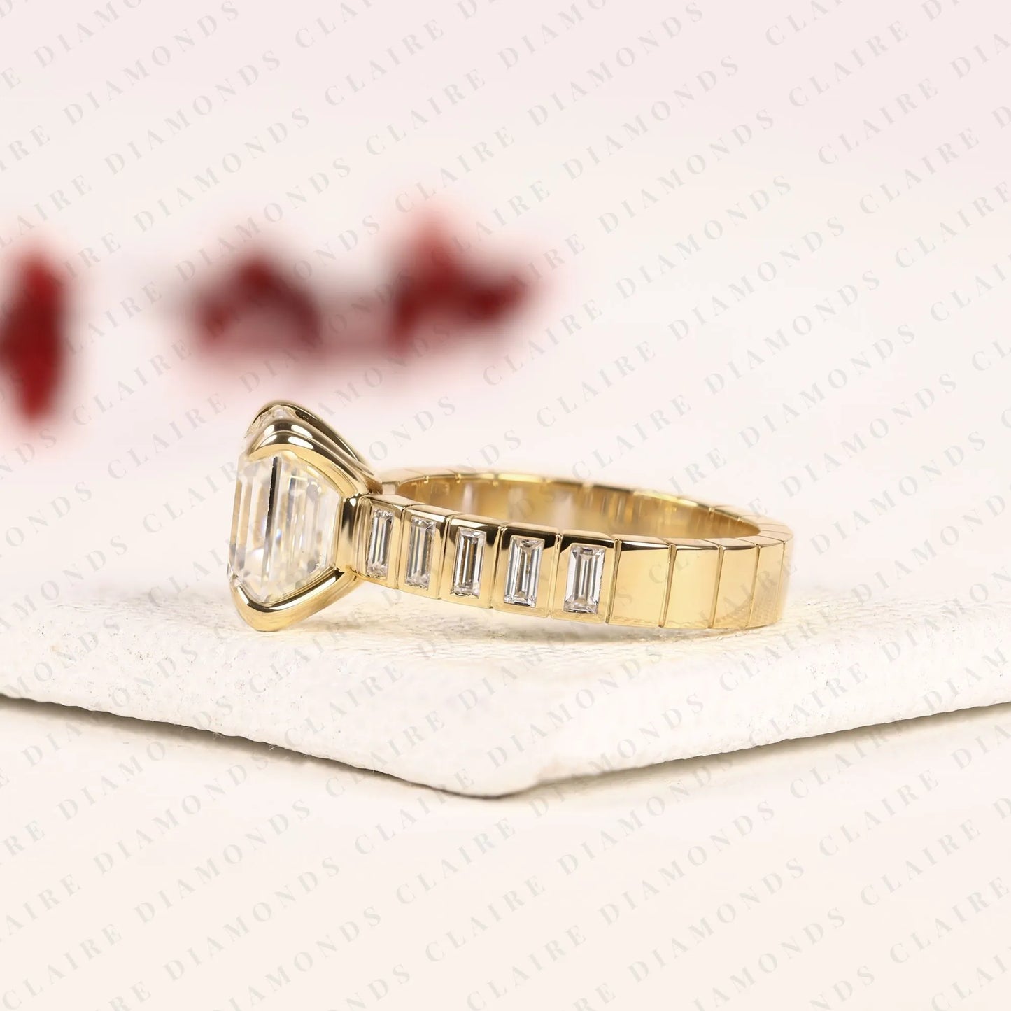 asscher cut lab diamond engagement ring with baguette accent band in gold.