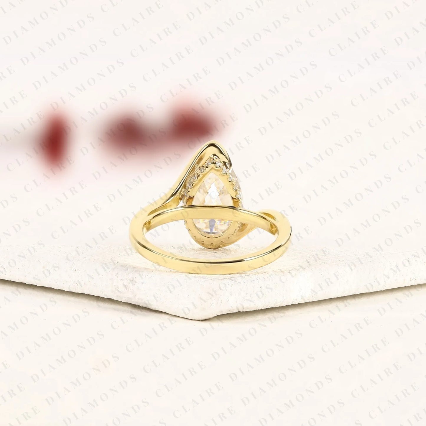pear shape lab grown diamond hidden halo solitaire ring with contemporary twist setting