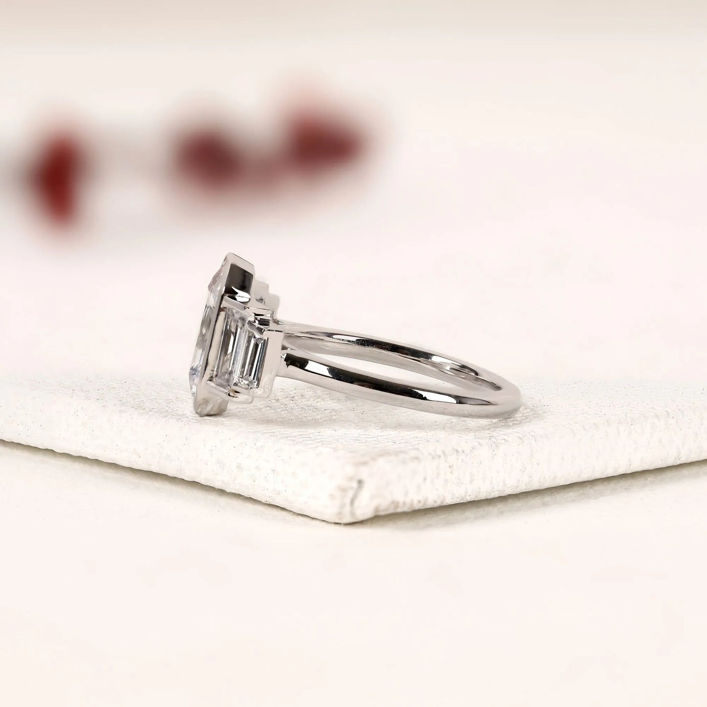 emerald cut three stone lab grown diamond engagement ring bezel set emerald diamond ring with tapered baguette side stones luxury bridal ring