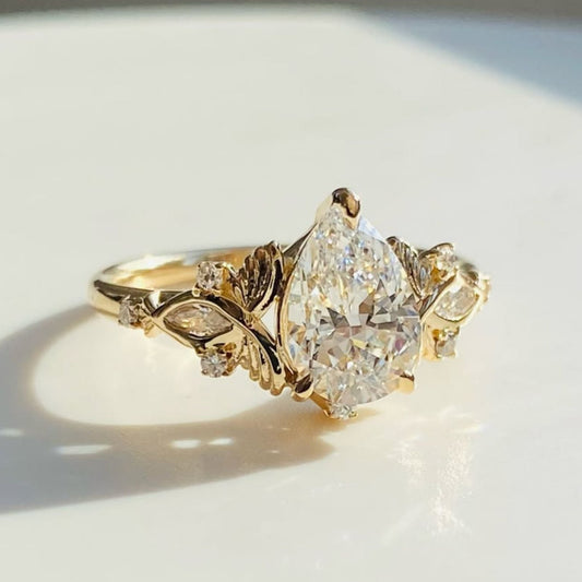 Vintage Inspired Pear Cut Lab Grown Diamond Engagement Ring with Floral Leaf Side Accents in Solid Gold