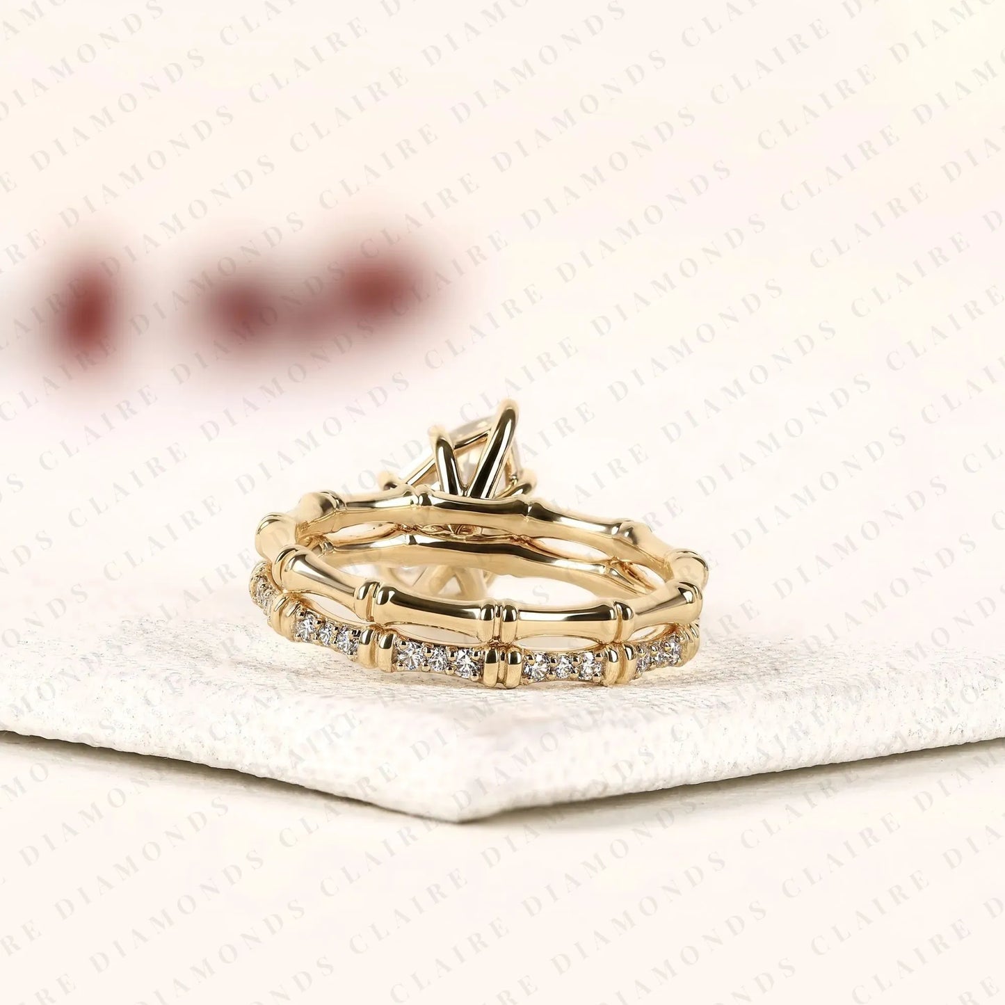 luxury pear cut moissanite diamond engagement ring with pavé diamond accents and bamboo inspired matching wedding band set