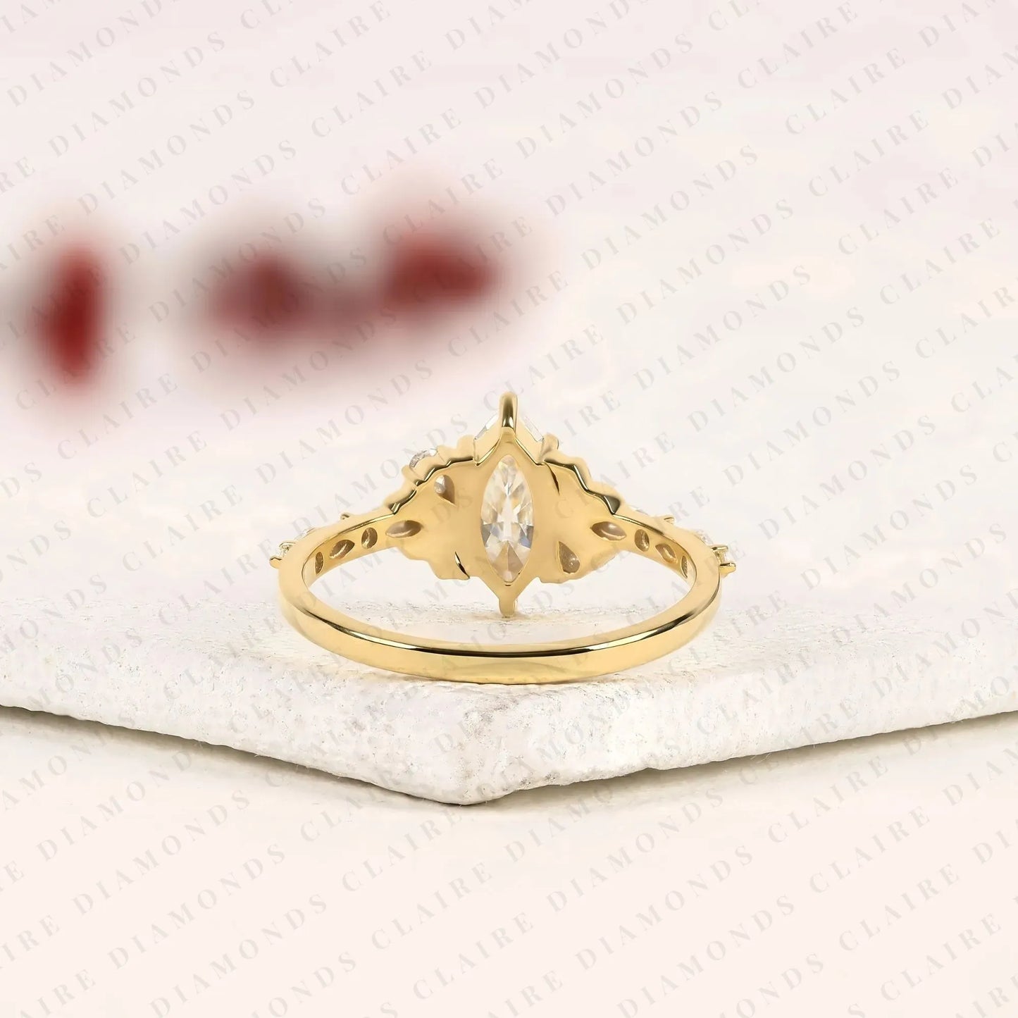 marquise cut lab grown diamond engagement ring with side accent diamonds | elegant three stone bridal ring in white gold