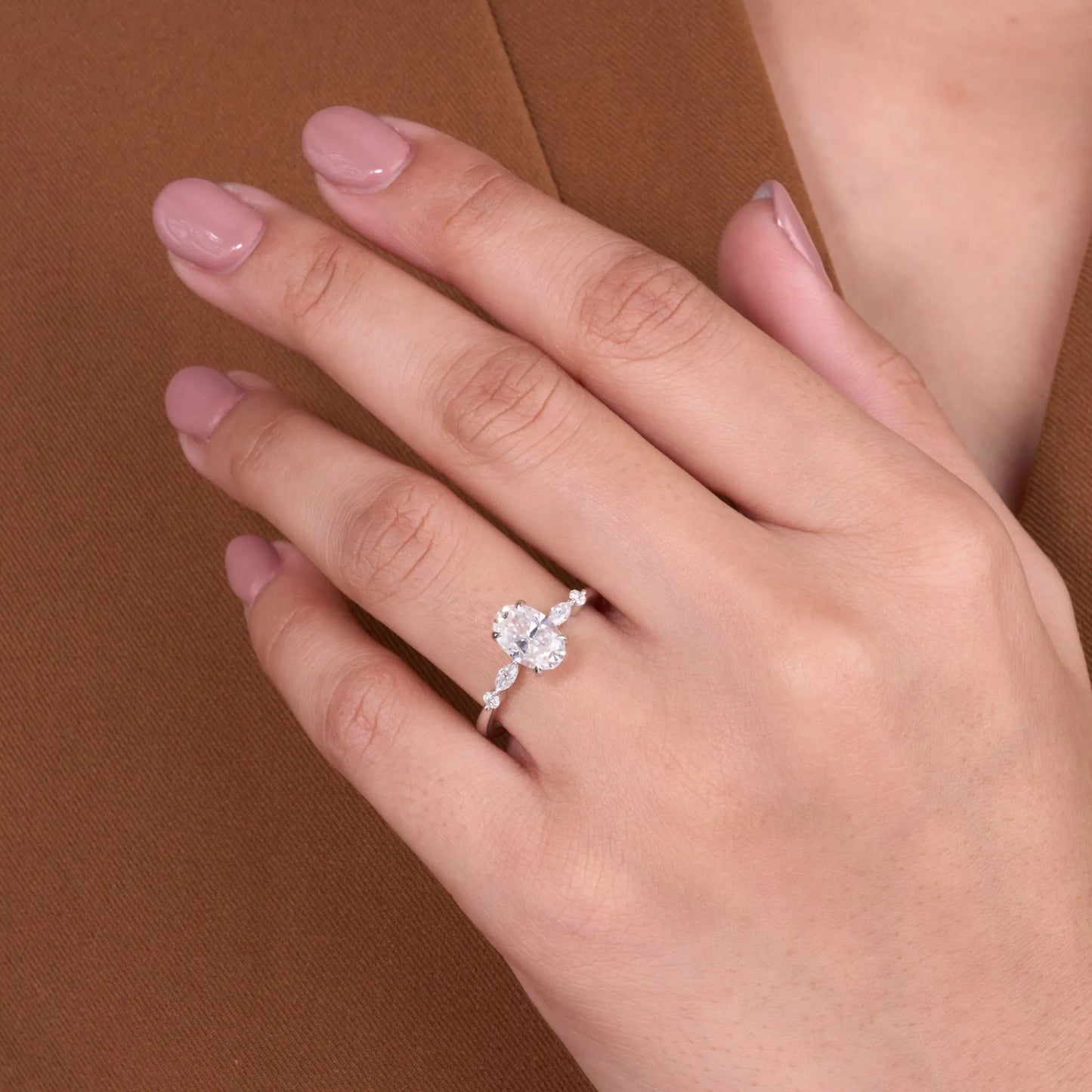 elegant oval cut lab grown diamond engagement ring with marquise side stones in white gold