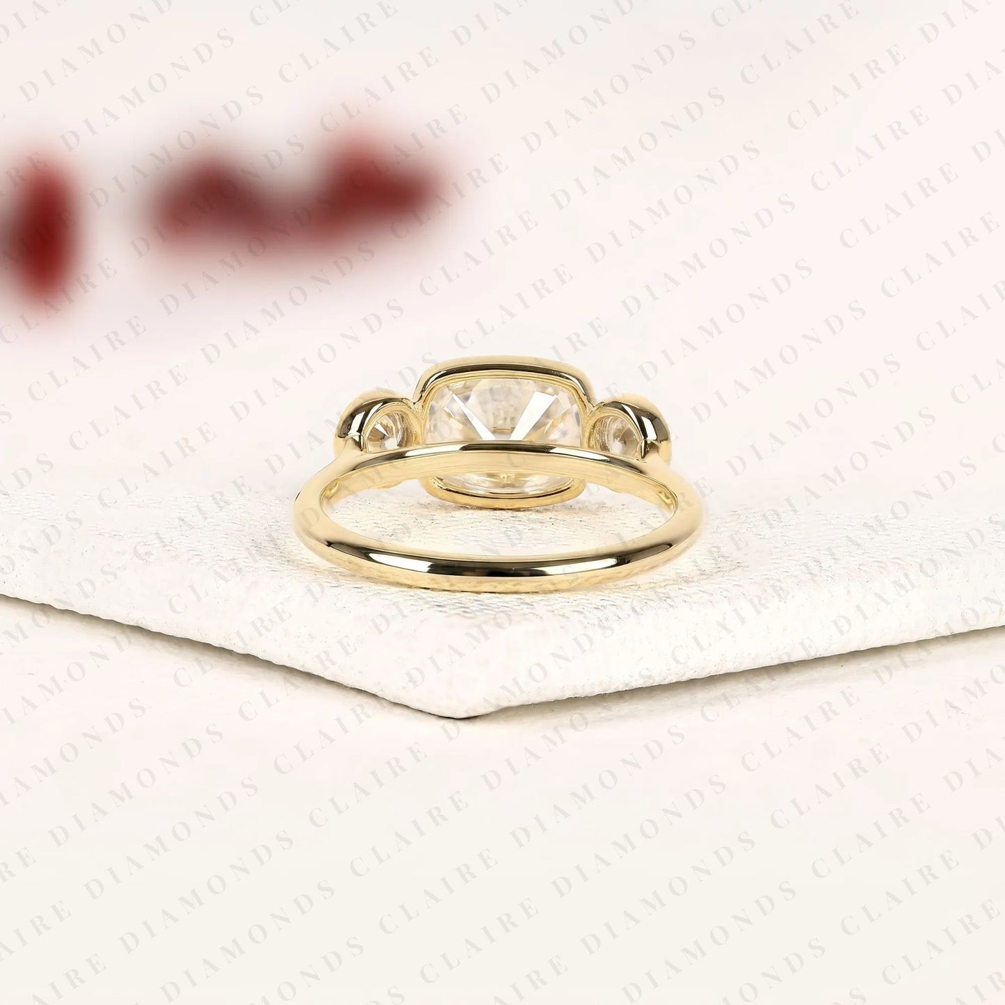 elongated cushion cut bezel set three stone lab grown diamond engagement ring modern gold ring minimalist bridal jewelry.