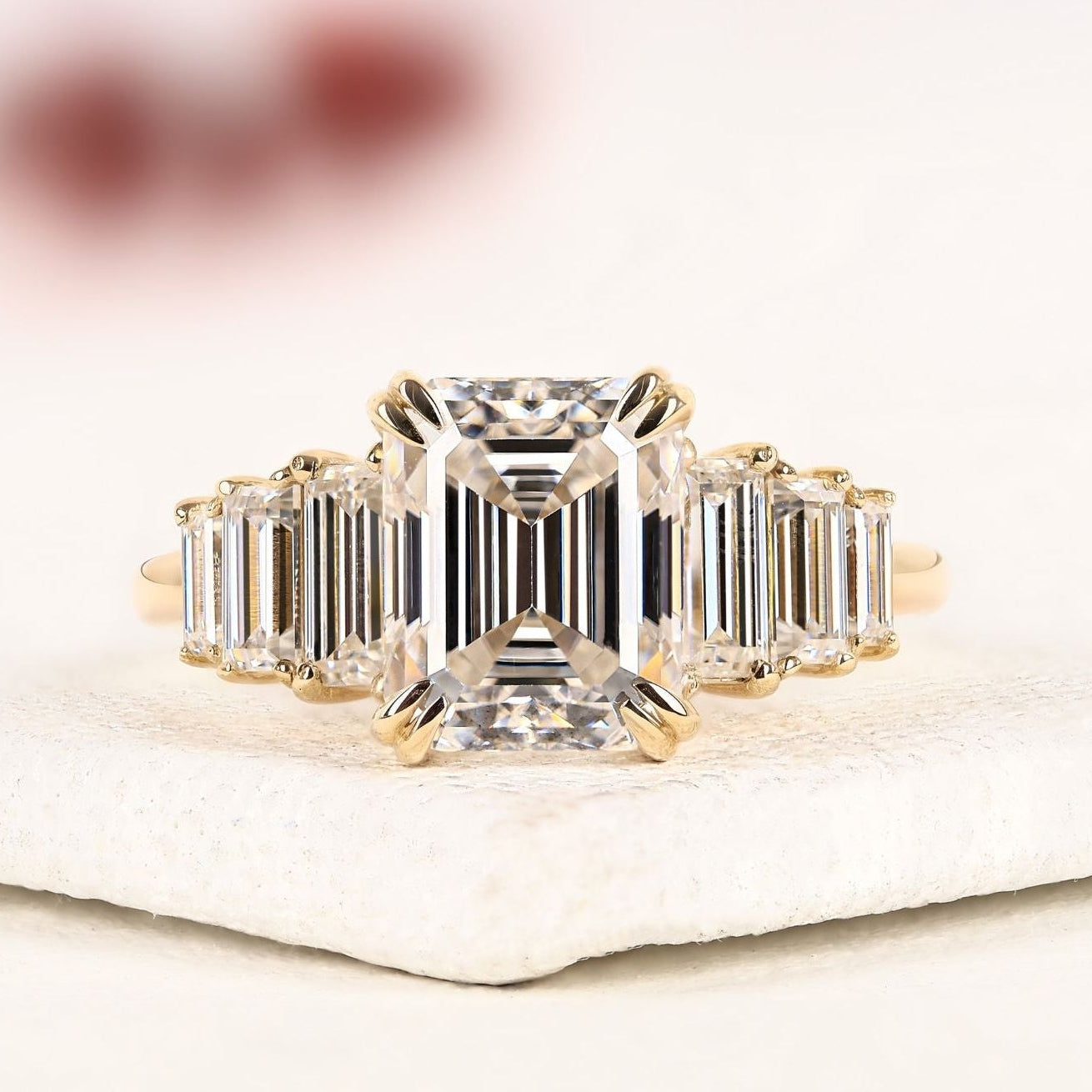 emerald cut moissanite diamond engagement ring in yellow gold | side stone baguette diamond wedding ring | luxury anniversary ring for women