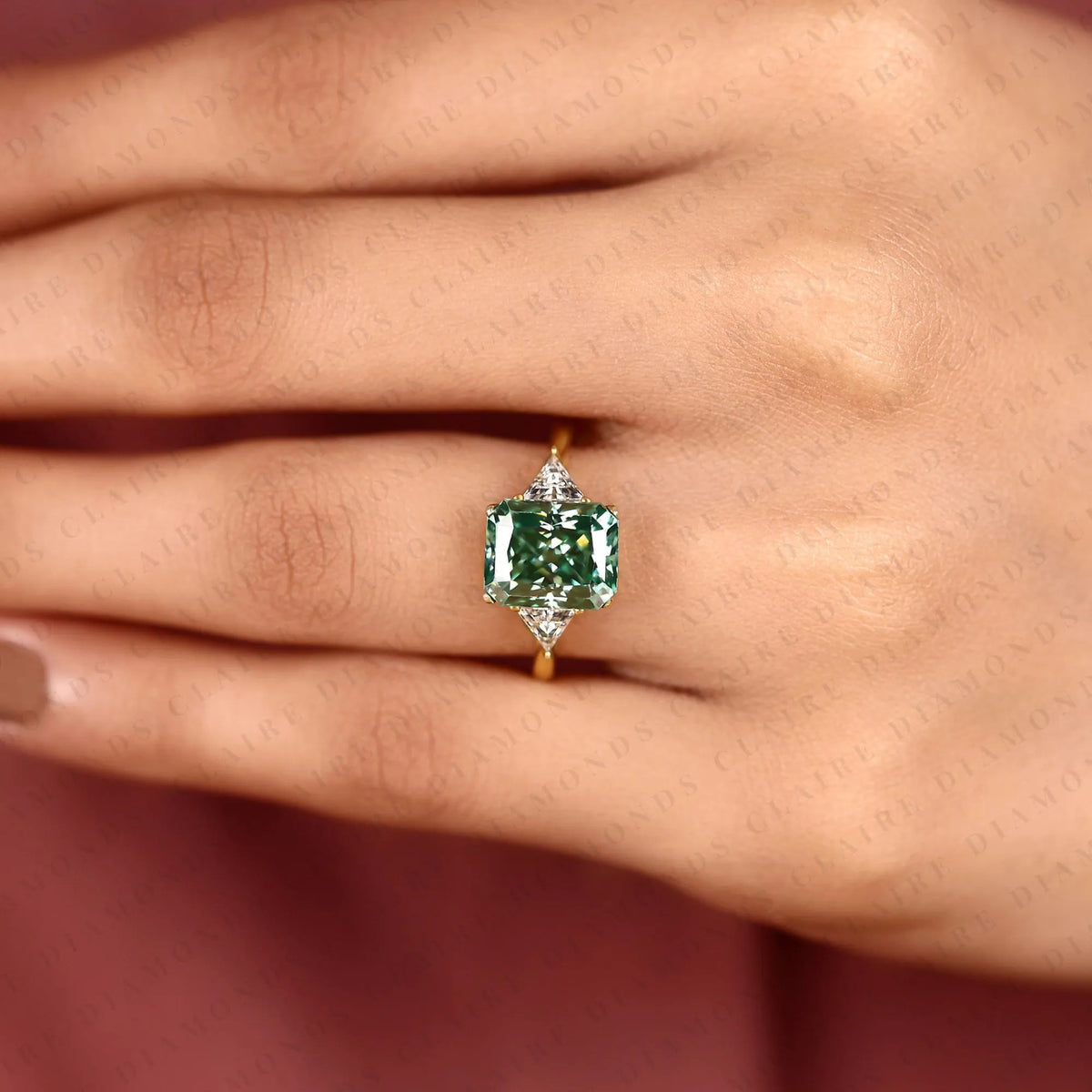 radiant cut green lab grown diamond engagement ring  three stone ring with trillion diamond accents luxury bridal jewelry