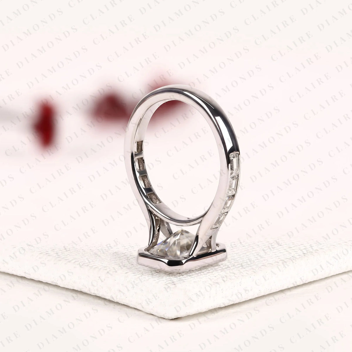 radiant cut moissanite diamond bezel set engagement ring with baguette pave set white gold modern luxury bridal jewelry