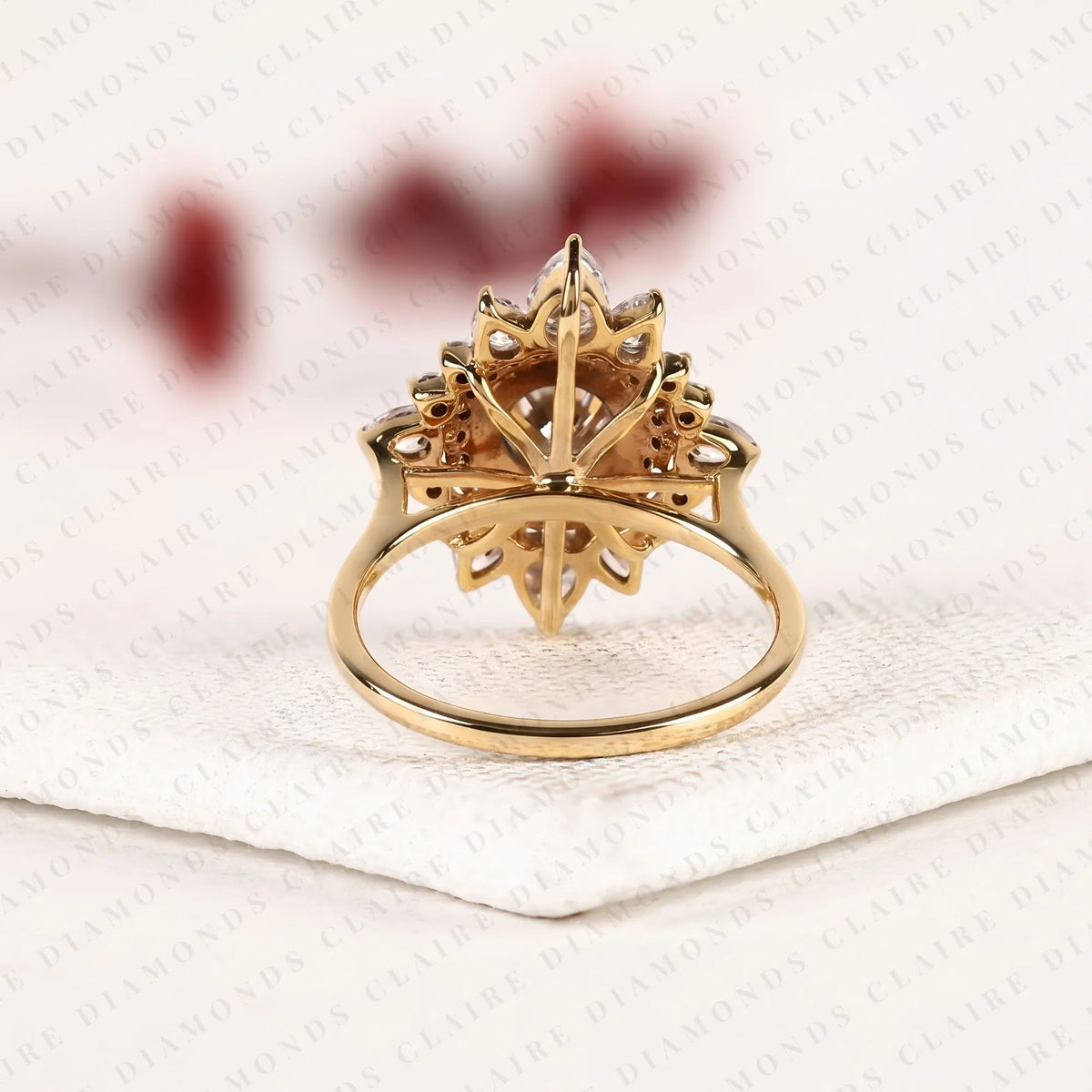 round cut lab grown diamond halo engagement ring floral sunburst design with pear diamond accents in gold