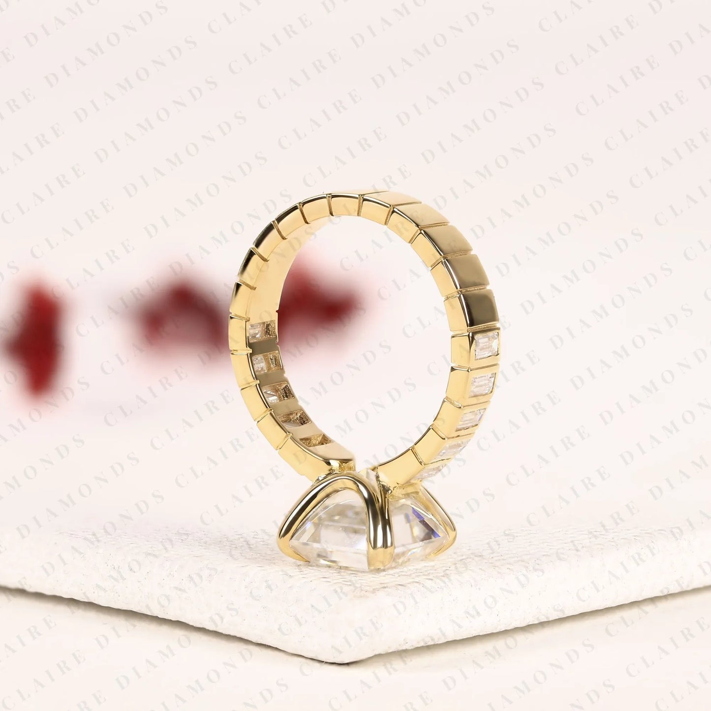 asscher cut lab diamond engagement ring with baguette accent band in gold.