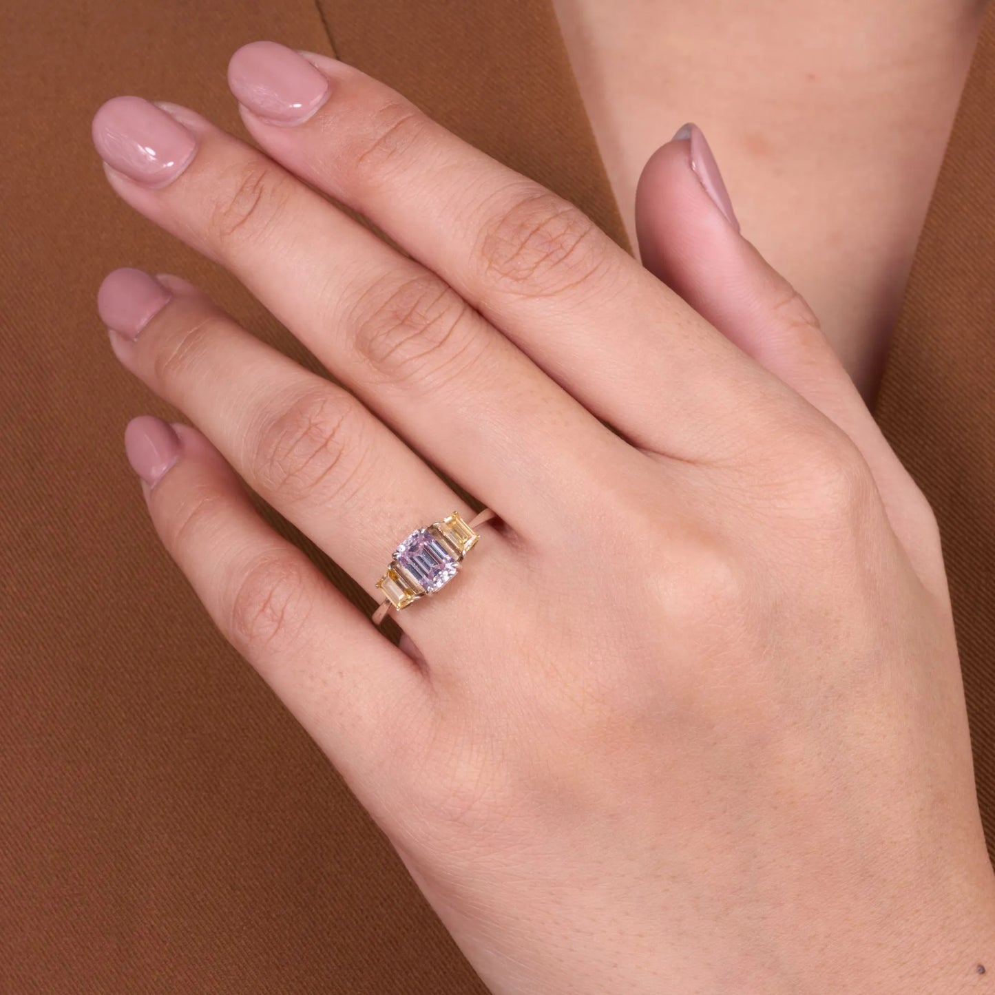 elegant emerald cut pink & champagne yellow moissanite diamond three stone engagement ring in gold