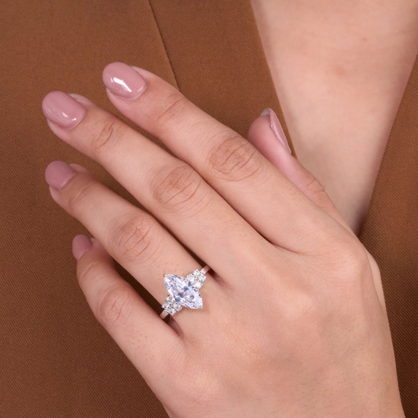timeless marquise lab grown diamond ring with delicate sparkling side stone detailing and elegant engagement ring