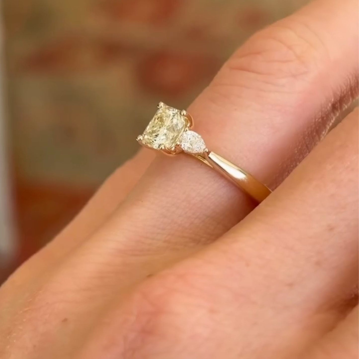 elegant cushion cut moissanite diamond three-stone ring in gold minimalist engagement ring