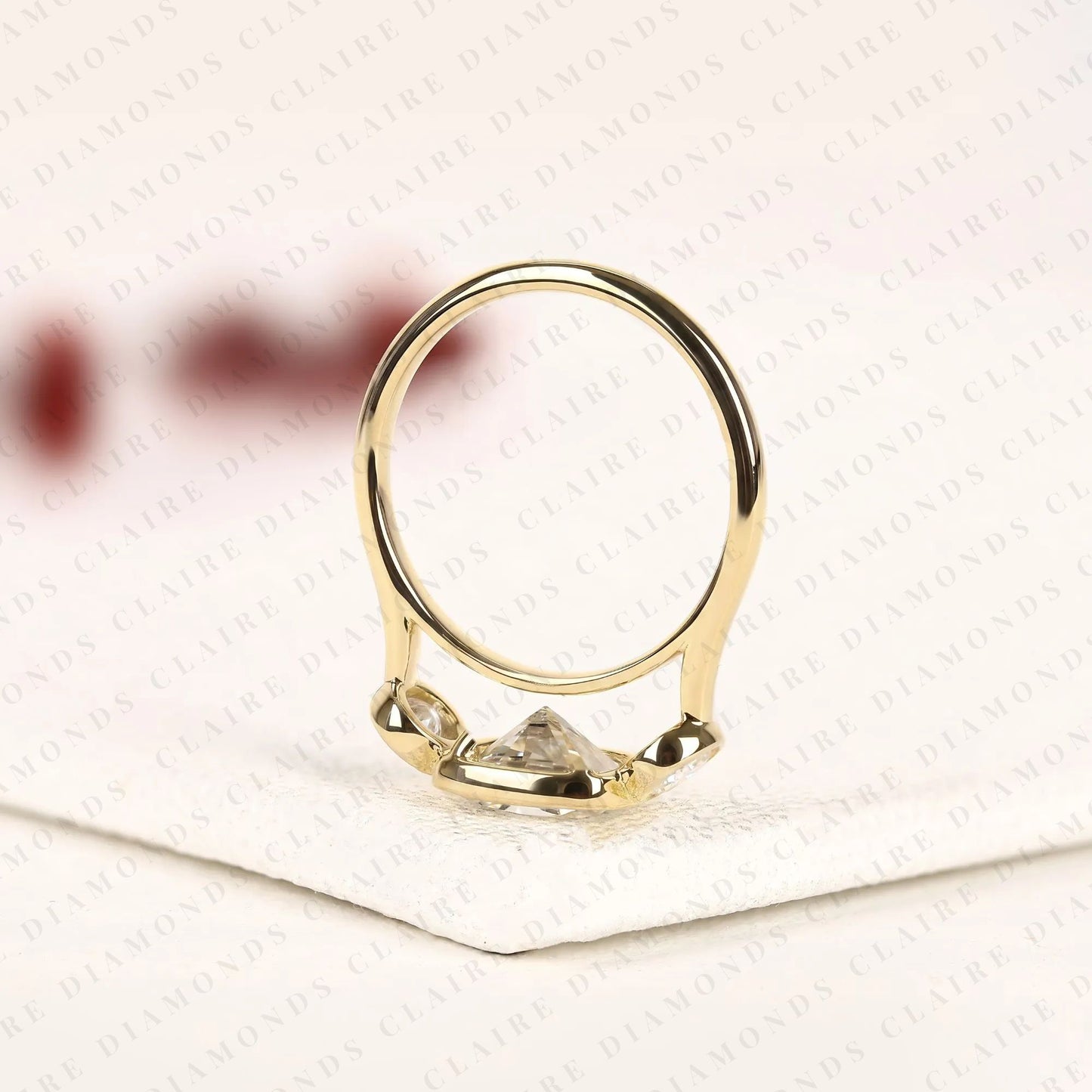 elongated cushion cut bezel set three stone lab grown diamond engagement ring modern gold ring minimalist bridal jewelry.