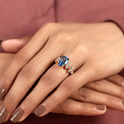Pear Cut Blue Lab Grown Engagement Ring, Round Diamond Floral Side Stones, Yellow Gold Nature-Inspired Bridal Ring