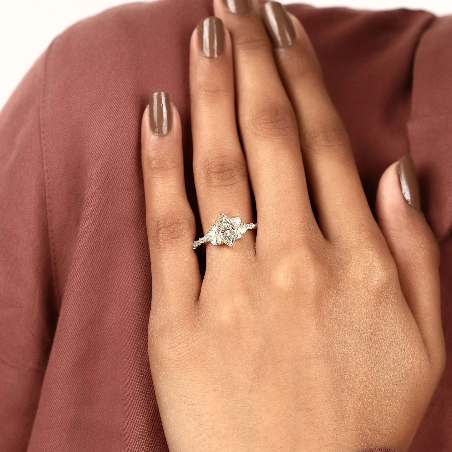 marquise cut lab grown diamond engagement ring with side accent diamonds | elegant three stone bridal ring in white gold