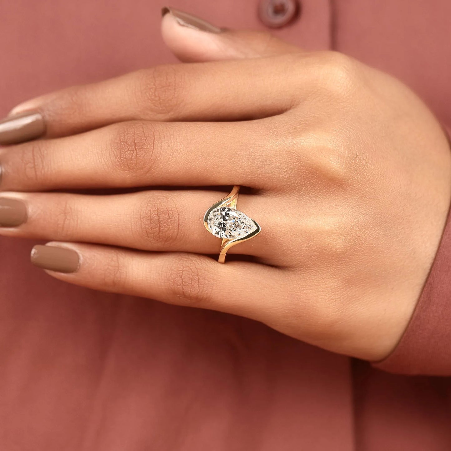 pear shape lab grown diamond hidden halo solitaire ring with contemporary twist setting