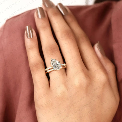 Luxury Pear Cut Moissanite Diamond Engagement Ring with Pavé Diamond Accents and Bamboo Inspired Matching Wedding Band Set