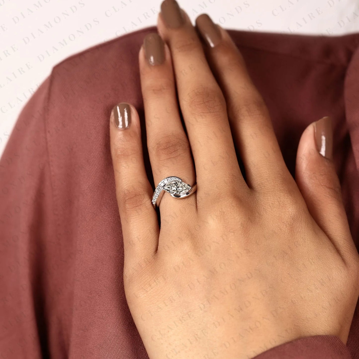 marquise cut lab grown diamond east west bypass engagement ring in gold with round side stones , modern bridal jewelry.