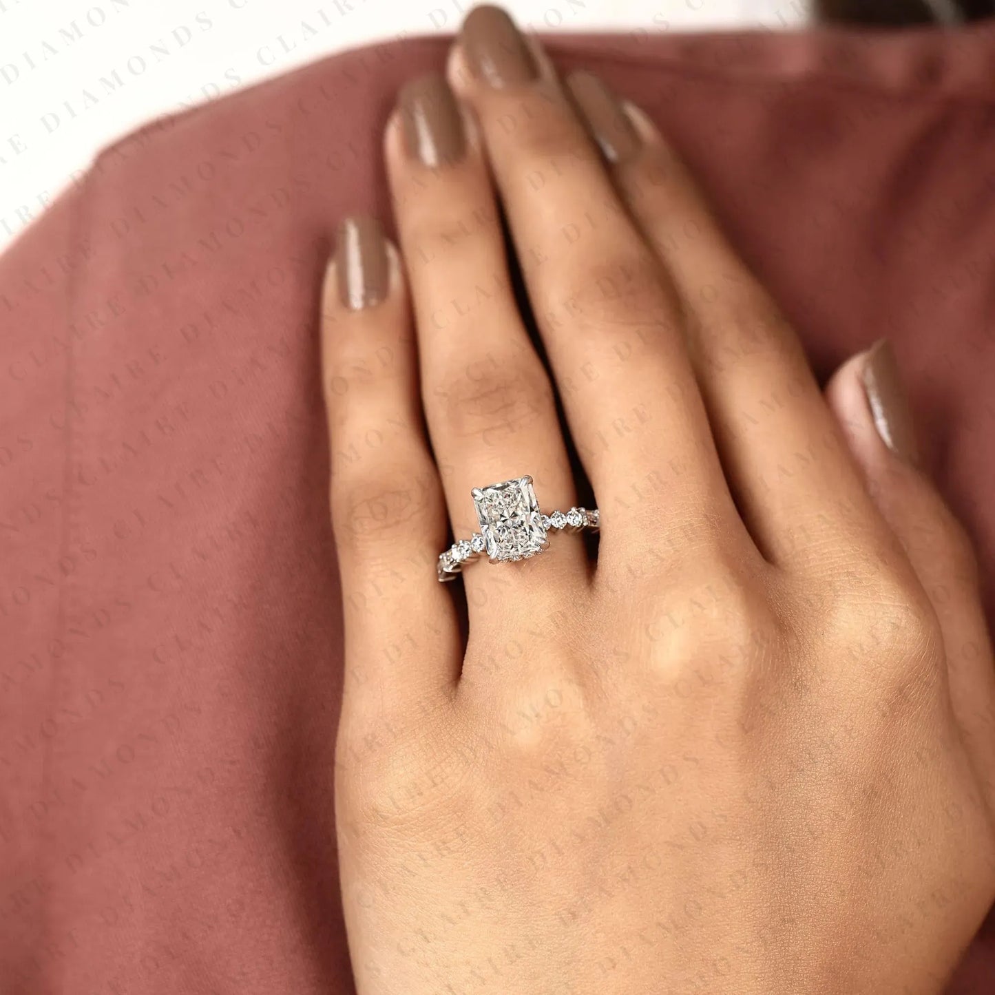 radiant cut moissanite diamond engagement ring with round and baguette side stone accents